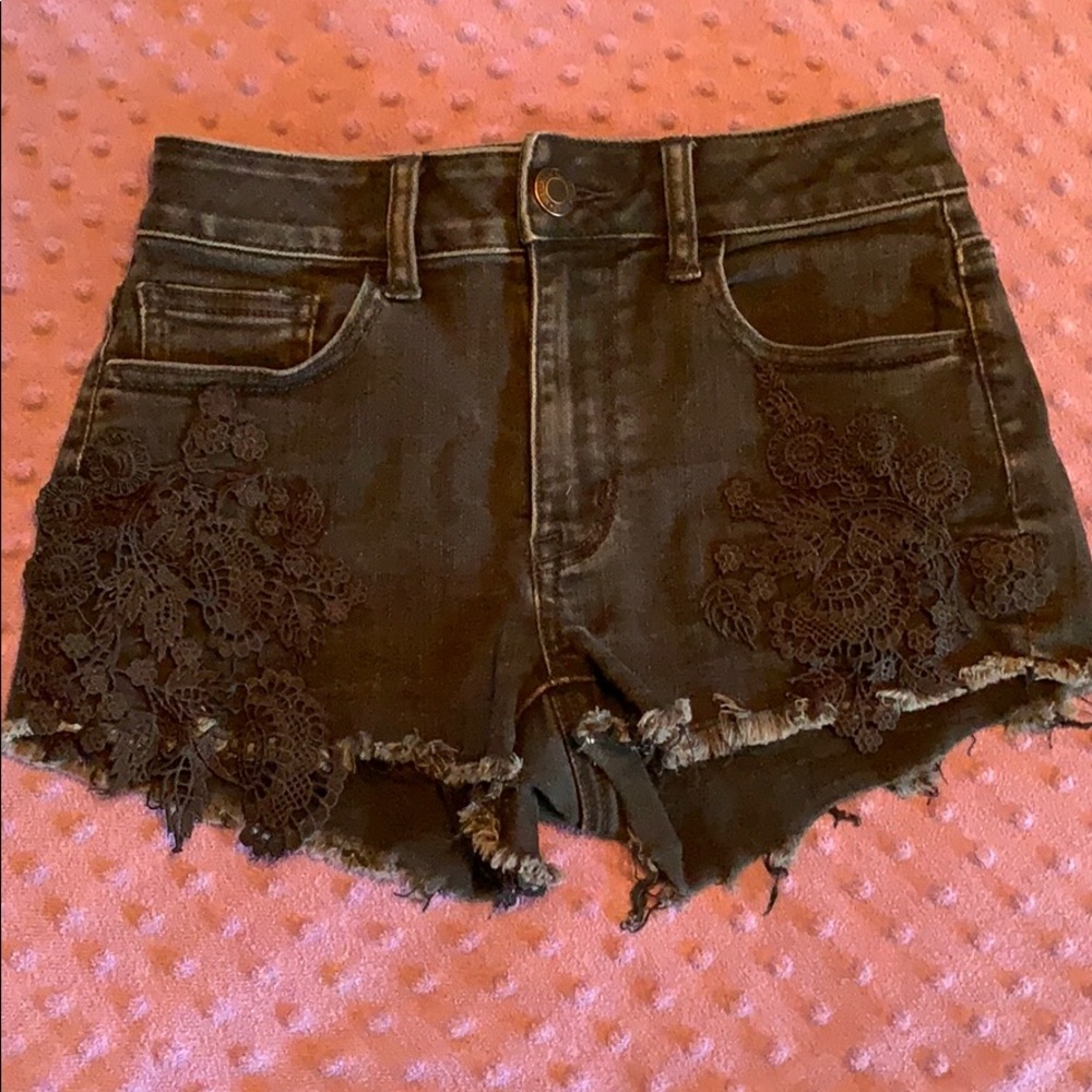 Black jean shorts with flower pattern